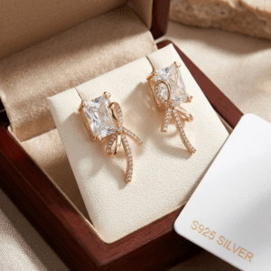S925 Silver Rose Gold Ribbon Bow Crystal Stud Earrings inside a premium wooden box.