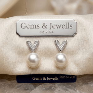 S925 Silver Heart Crystal Pave Pearl Drop Earrings displayed on a Gems and Jewells card.