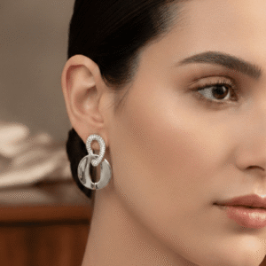 Silver Interlocking Oval Hoop Statement Earrings worn by a female model.